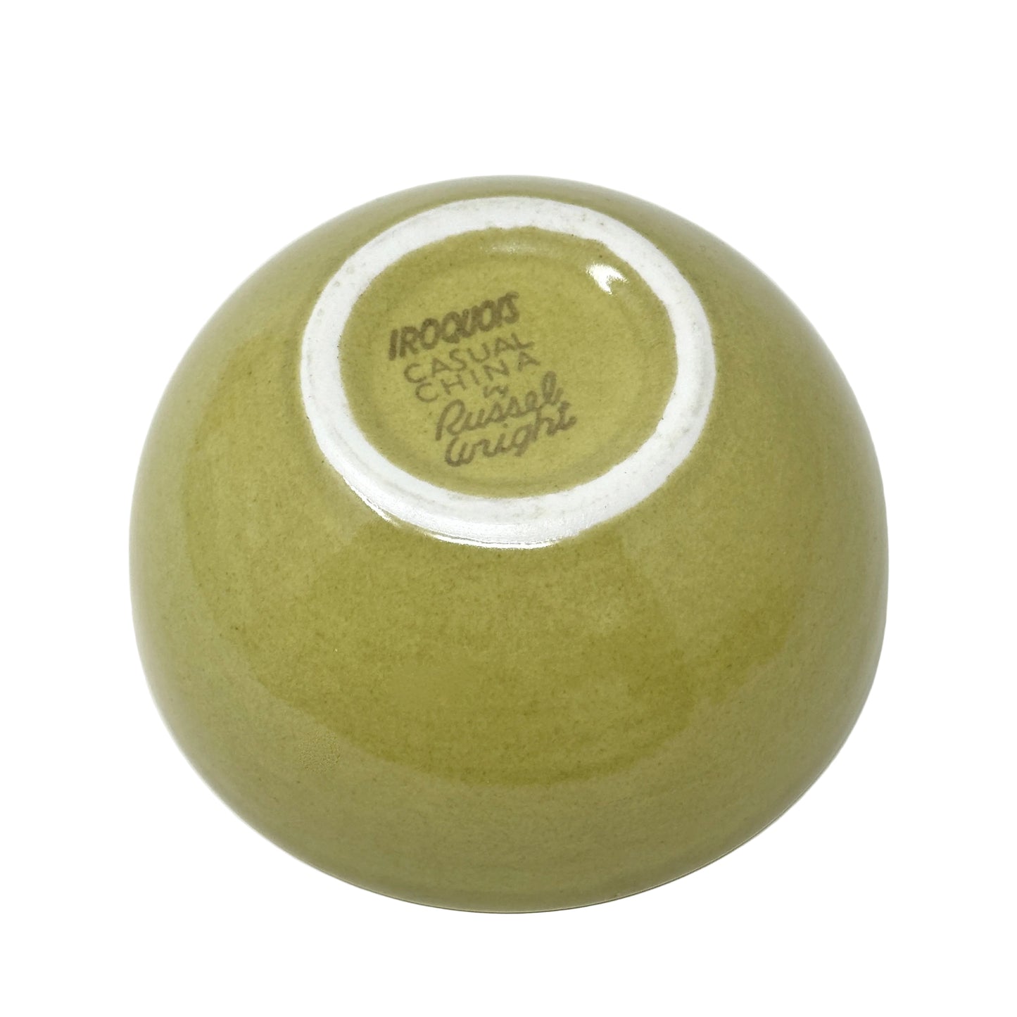 Green ceramic bowl with 'Iroquois Casual China' branding on a white background