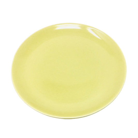 Yellow ceramic plate on a white background