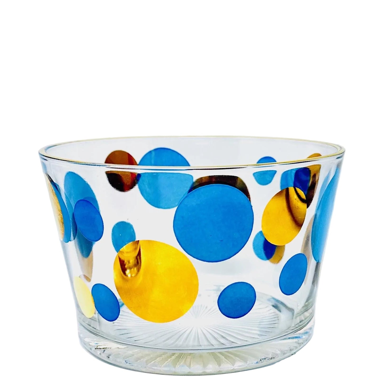 Clear glass with blue and yellow polka dots on a white background