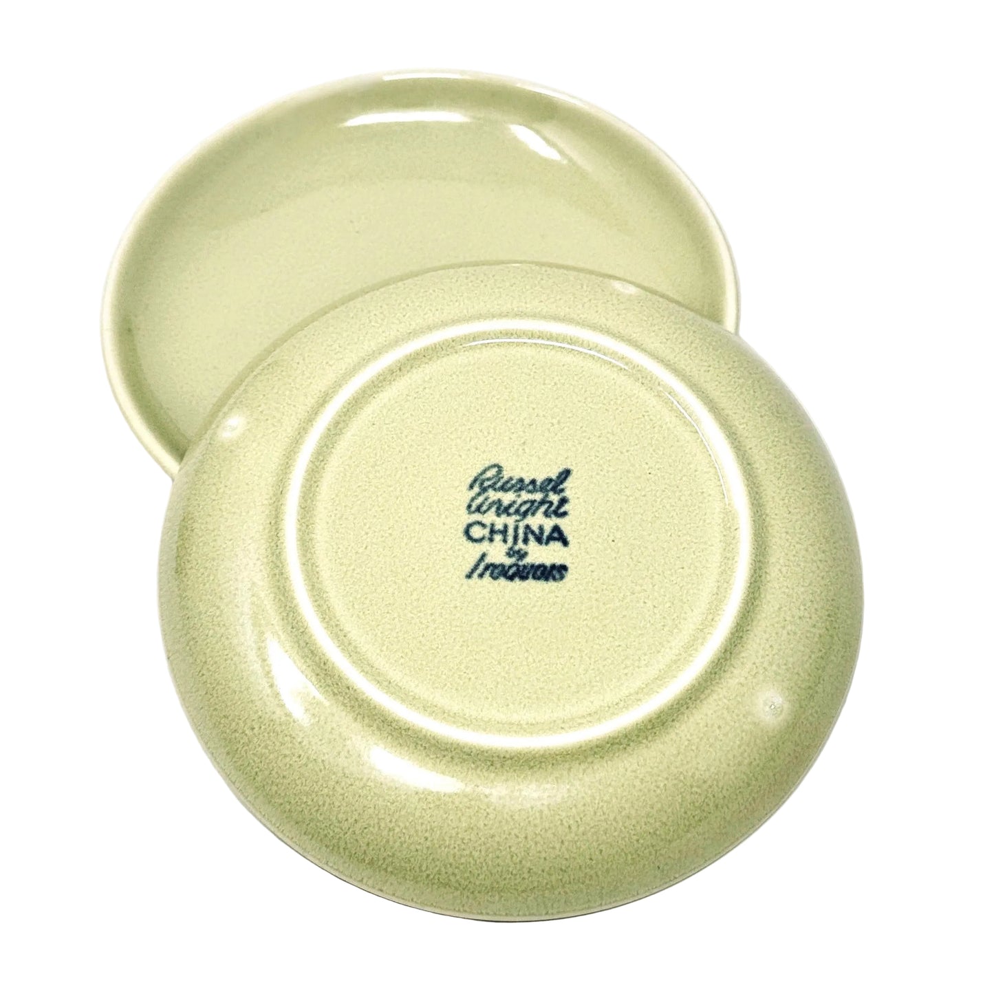 Two green ceramic plates with 'Russell Wright China' branding on a white background