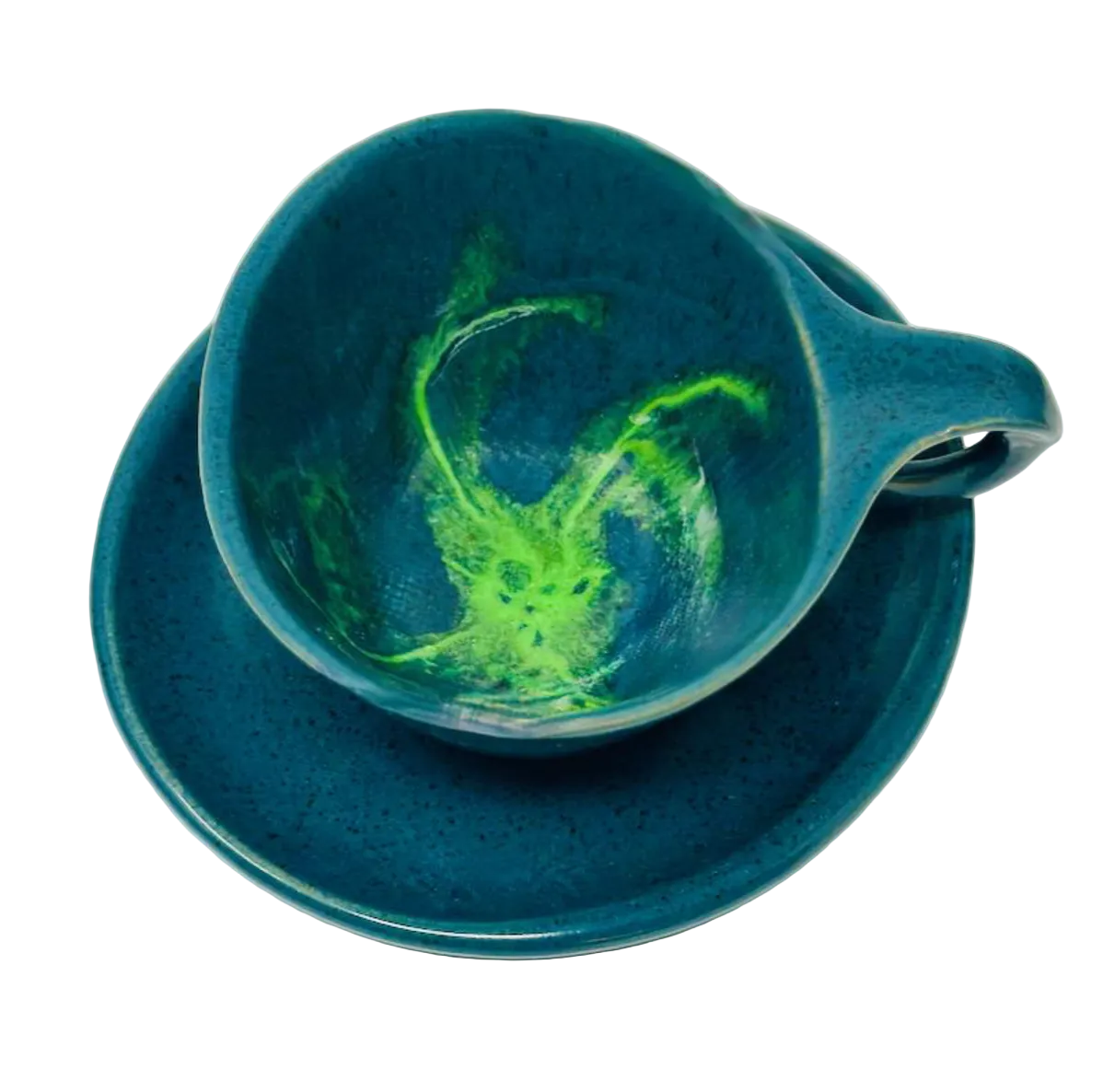 Blue ceramic cup and saucer with green abstract design on a white background